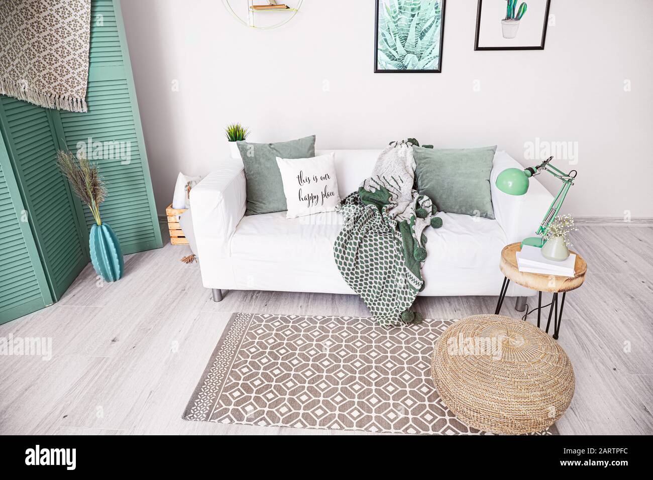 Stylish interior of living room with comfortable sofa Stock Photo - Alamy