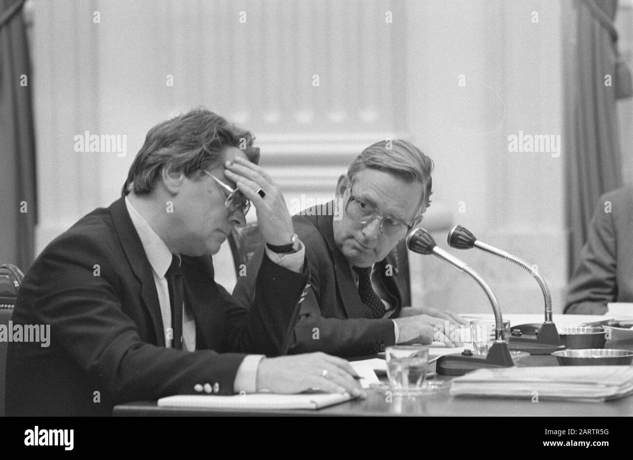 Special committee against fraud meeting in the House of Representatives on the report Abuse and Improper Use in the field of Taxation (ISMO), on combating fraud with social benefits  State Secretary De Graaf (Social Affairs) (l) and Minister Korthals Altes (Justice) Date: 13 June 1983 Location: The Hague, South Holland Keywords: taxes, fraud, ministers, parliamentary debates, social security, State secretaries Personal name: Graaf, Louw de, Korthals Altes, Frits Stock Photo