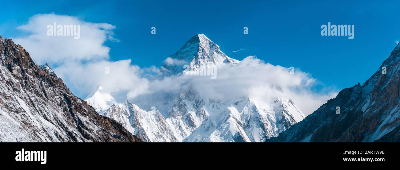 Close up panoramic view of K2, the second highest mountain in the world with Angel peak and Nera peak on the left side, Concordia, Pakistan Stock Photo