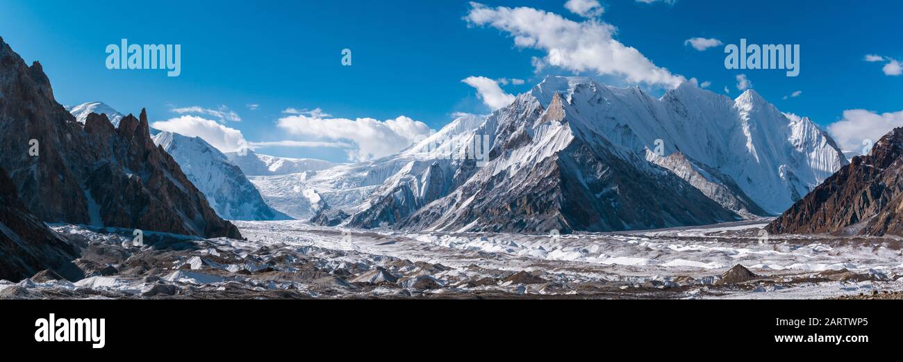 Panoramic view of Upper Baltoro Glacier with Vigne Peak in the middle and Chogolisa Peak, Snow Peak, Baltoro Kangri in background, from Concordia, Pak Stock Photo