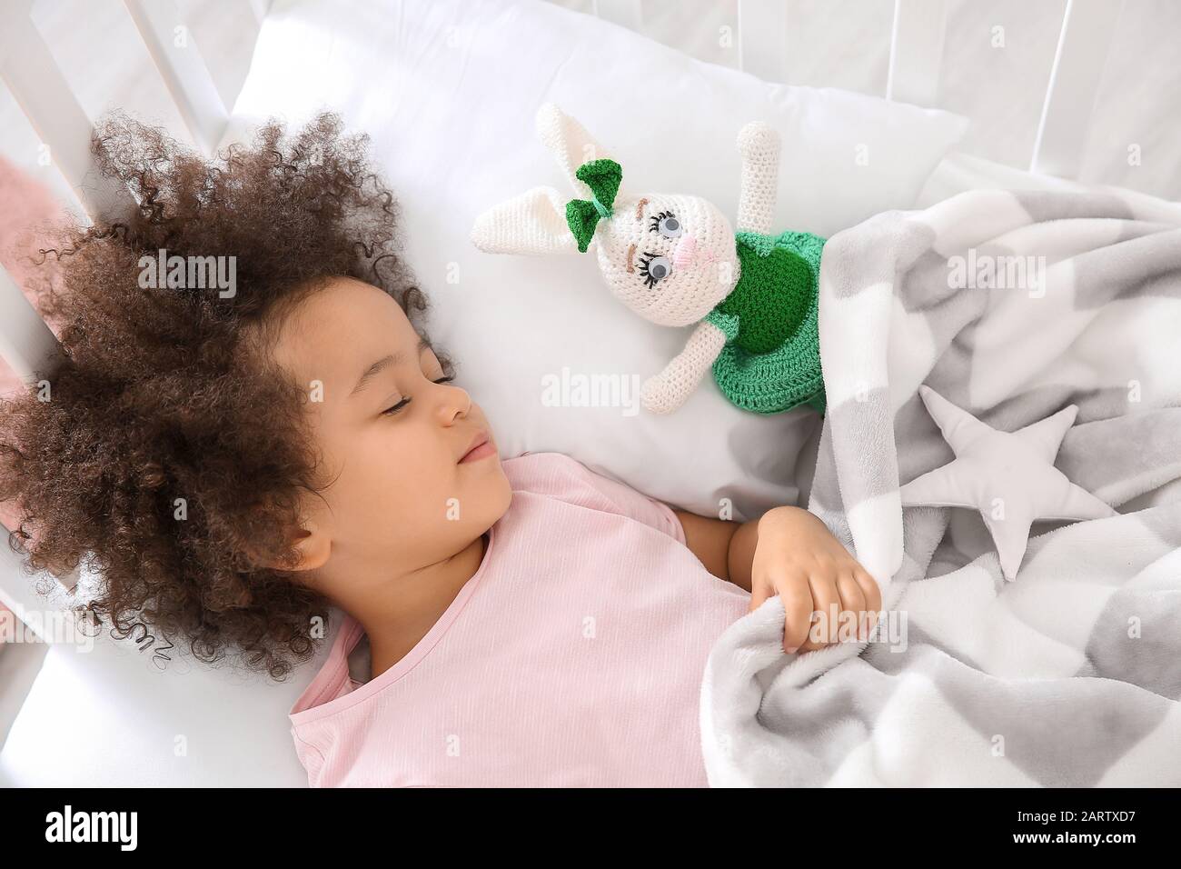 Little African-American girl sleeping in bed Stock Photo - Alamy