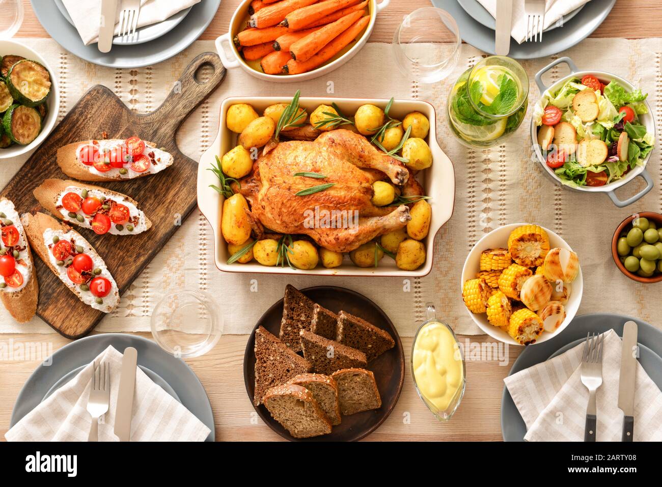 Table set for big family dinner Stock Photo - Alamy