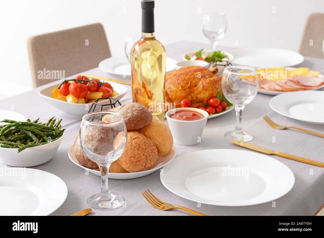Table set for big family dinner Stock Photo - Alamy