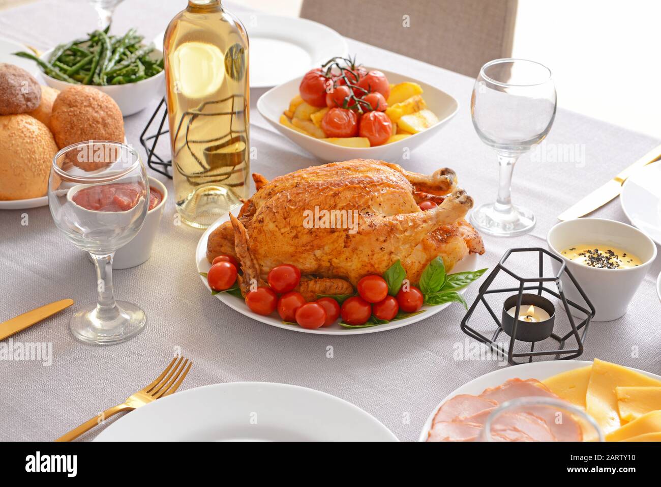 Table set for big family dinner Stock Photo - Alamy