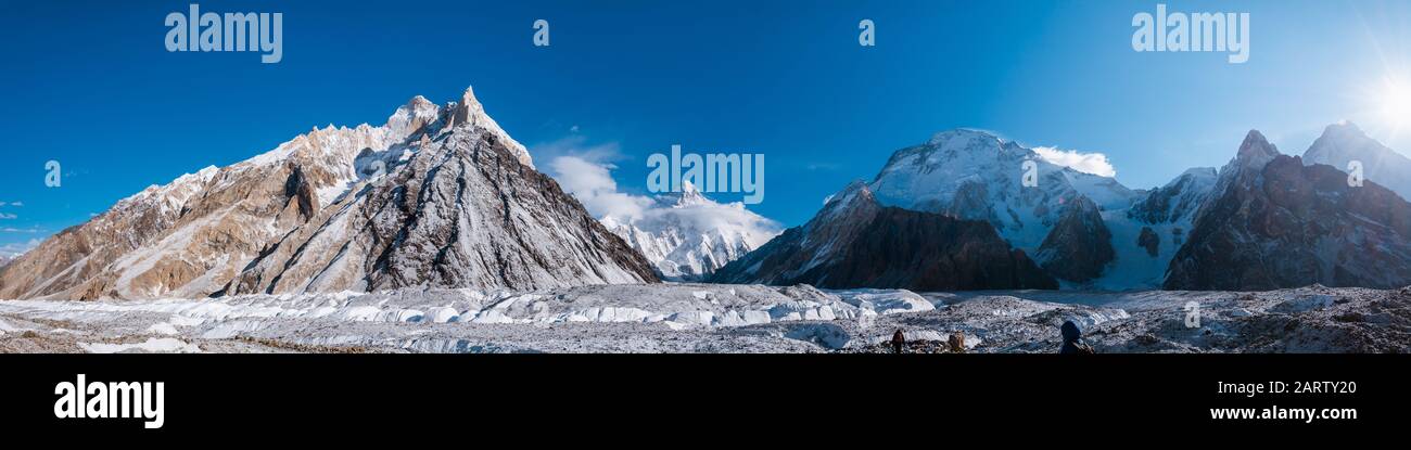 Panoramic view of K2, the second highest mountain in the world with surrounding mountains such as Crystal Peak, Marble Peak, Angel peak, Nera peak and Stock Photo