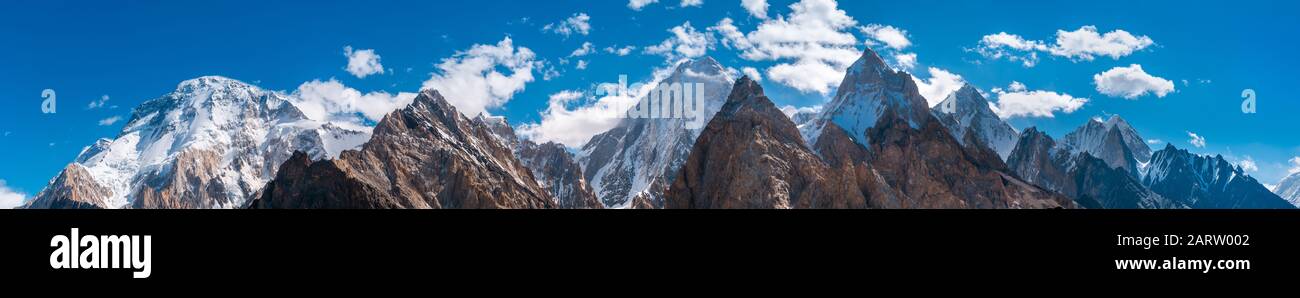 Panoramic view of Karakoram mountains range with Broad Peak, Gasherbrum (in the middle) from Vigne Glacier, on the way to Ali Camp, Pakistan Stock Photo