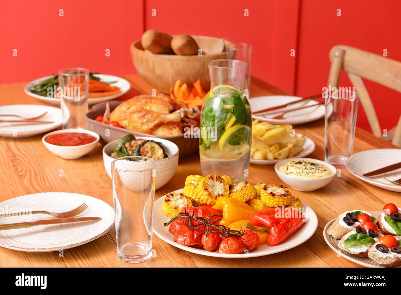 Table set for big family dinner Stock Photo - Alamy