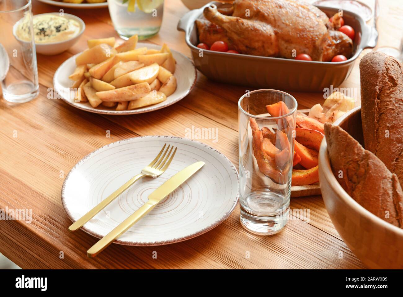 Table set for big family dinner Stock Photo - Alamy
