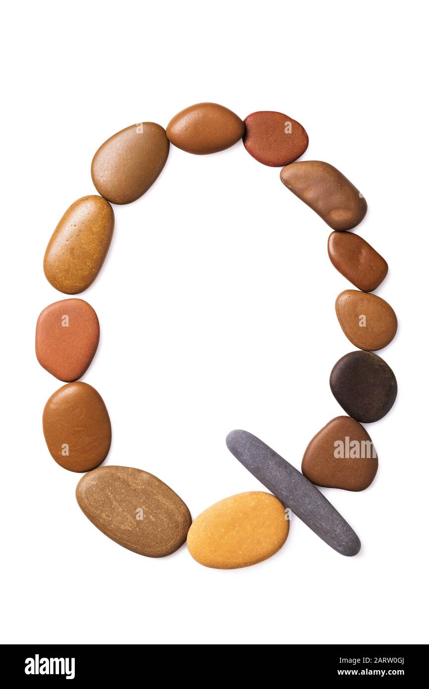 Letter Q made of marine small pebbles, top view. Alphabet made of stones Isolated on a white background Stock Photo