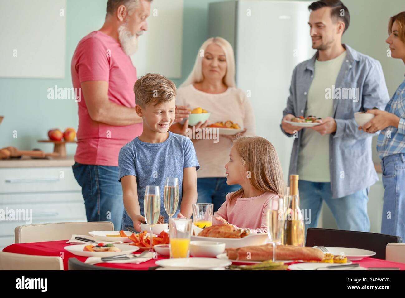 Family Table Resevers Big family serving table for dinner at home Stock Photo - Alamy