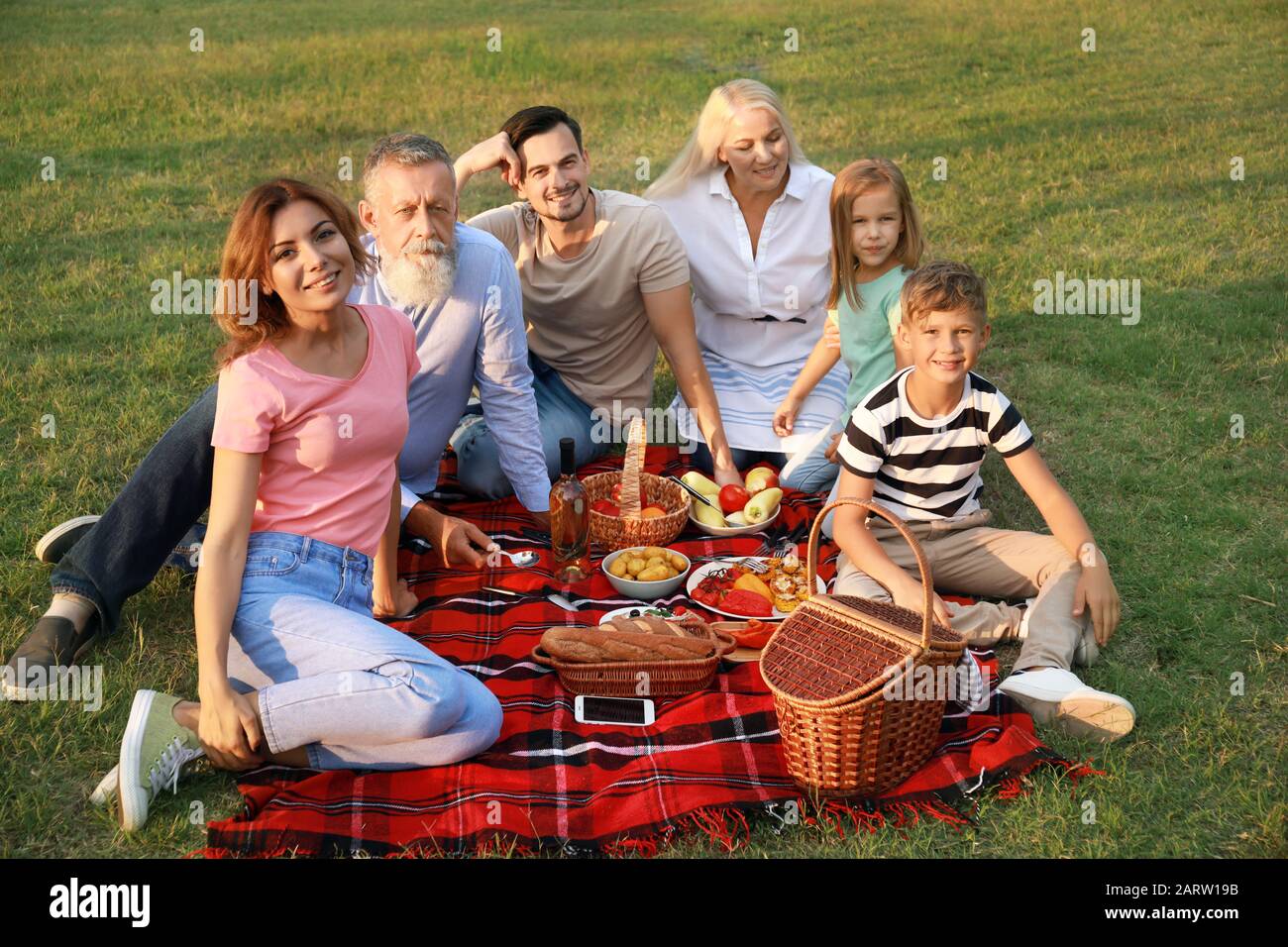 Big family having picnic in park Stock Photo - Alamy