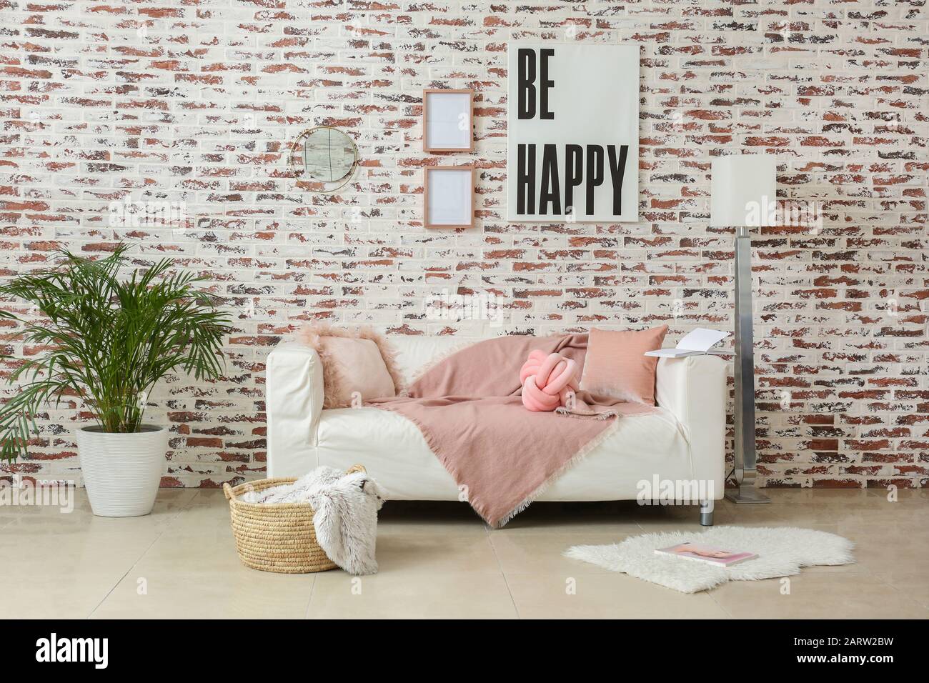 Stylish interior of modern living room with couch Stock Photo - Alamy