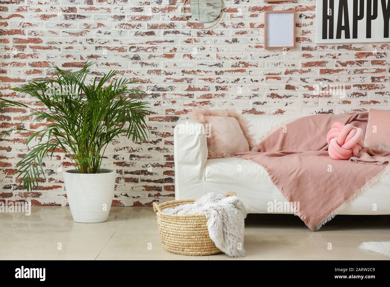 Stylish interior of modern living room with couch Stock Photo - Alamy