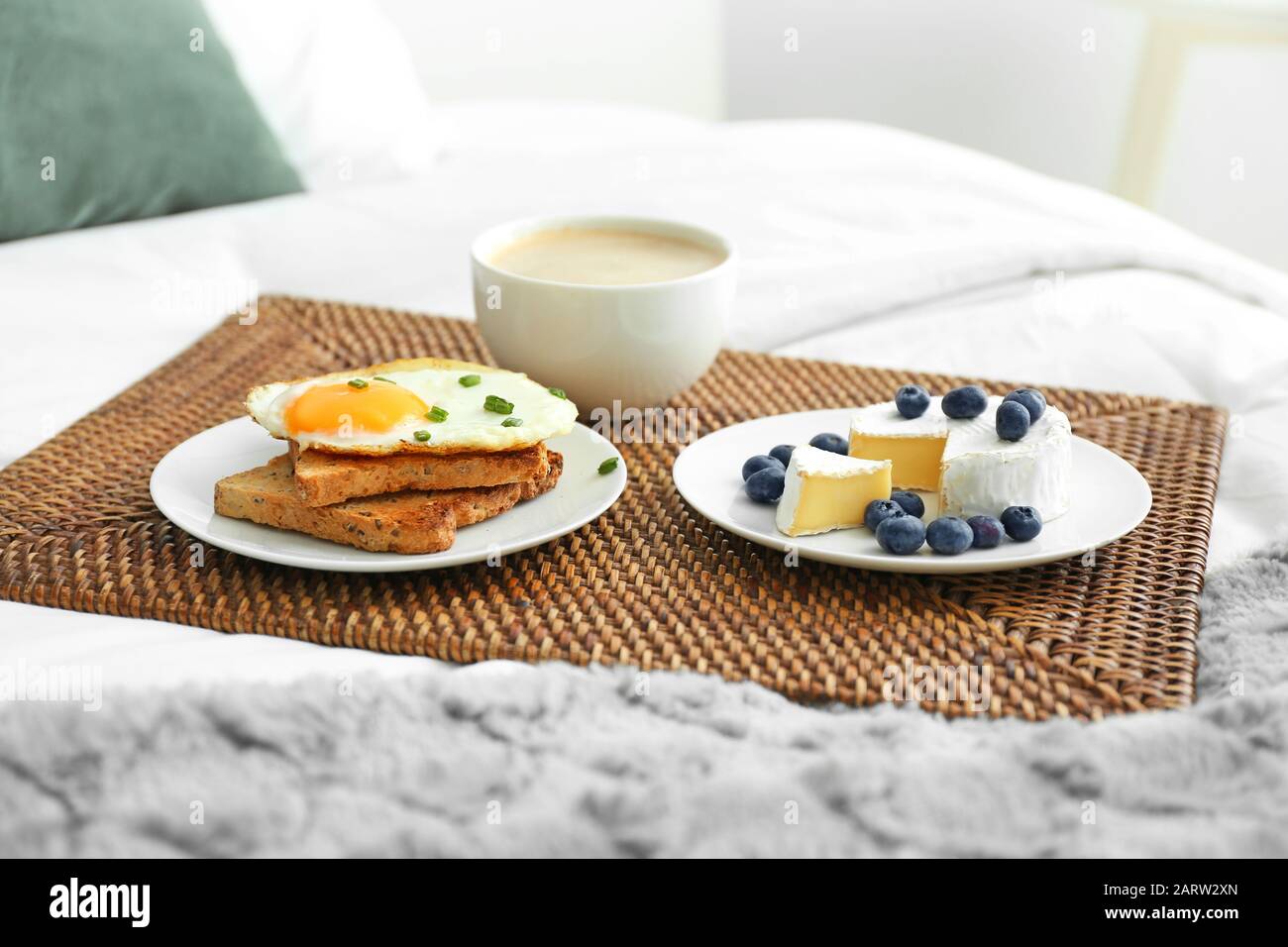 Tray with tasty breakfast on bed Stock Photo Alamy