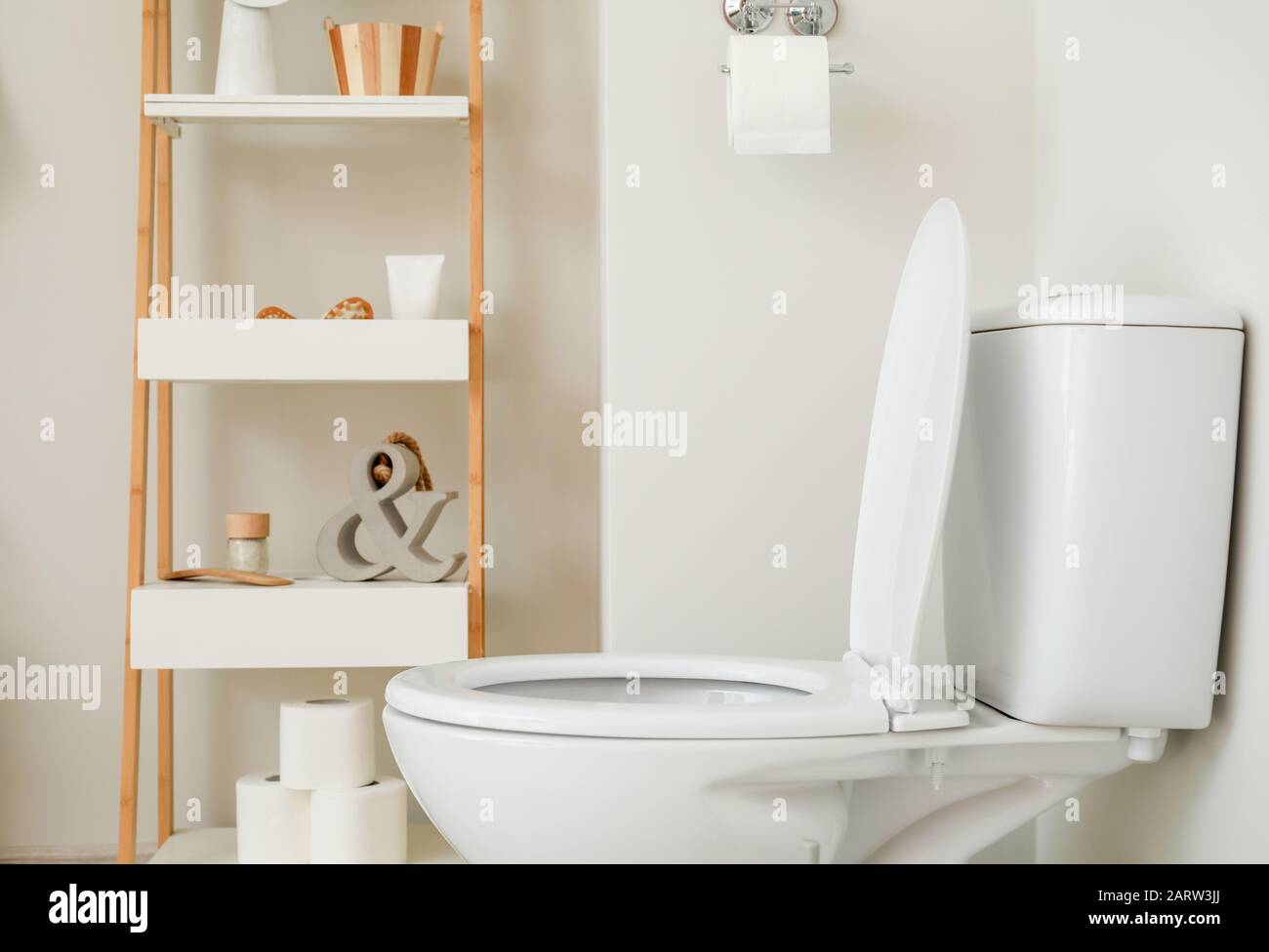 Modern ceramic toilet bowl in interior of restroom Stock Photo - Alamy