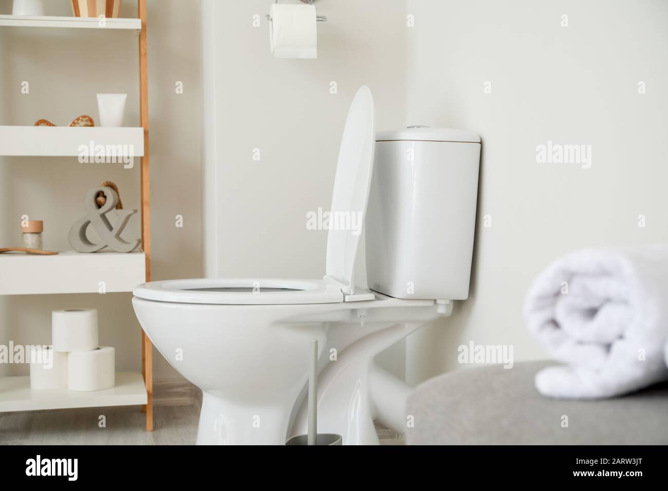 Modern ceramic toilet bowl in interior of restroom Stock Photo - Alamy