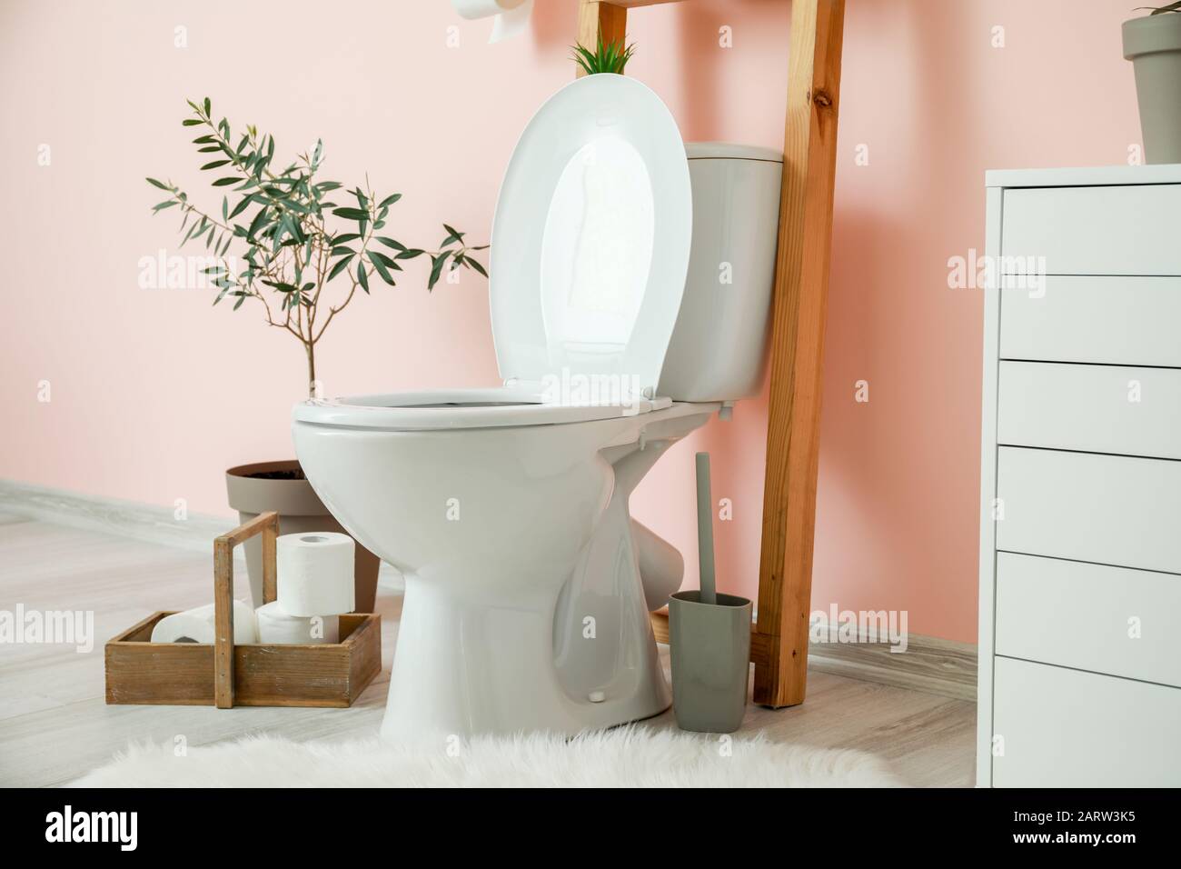 Modern ceramic toilet bowl in interior of restroom Stock Photo - Alamy