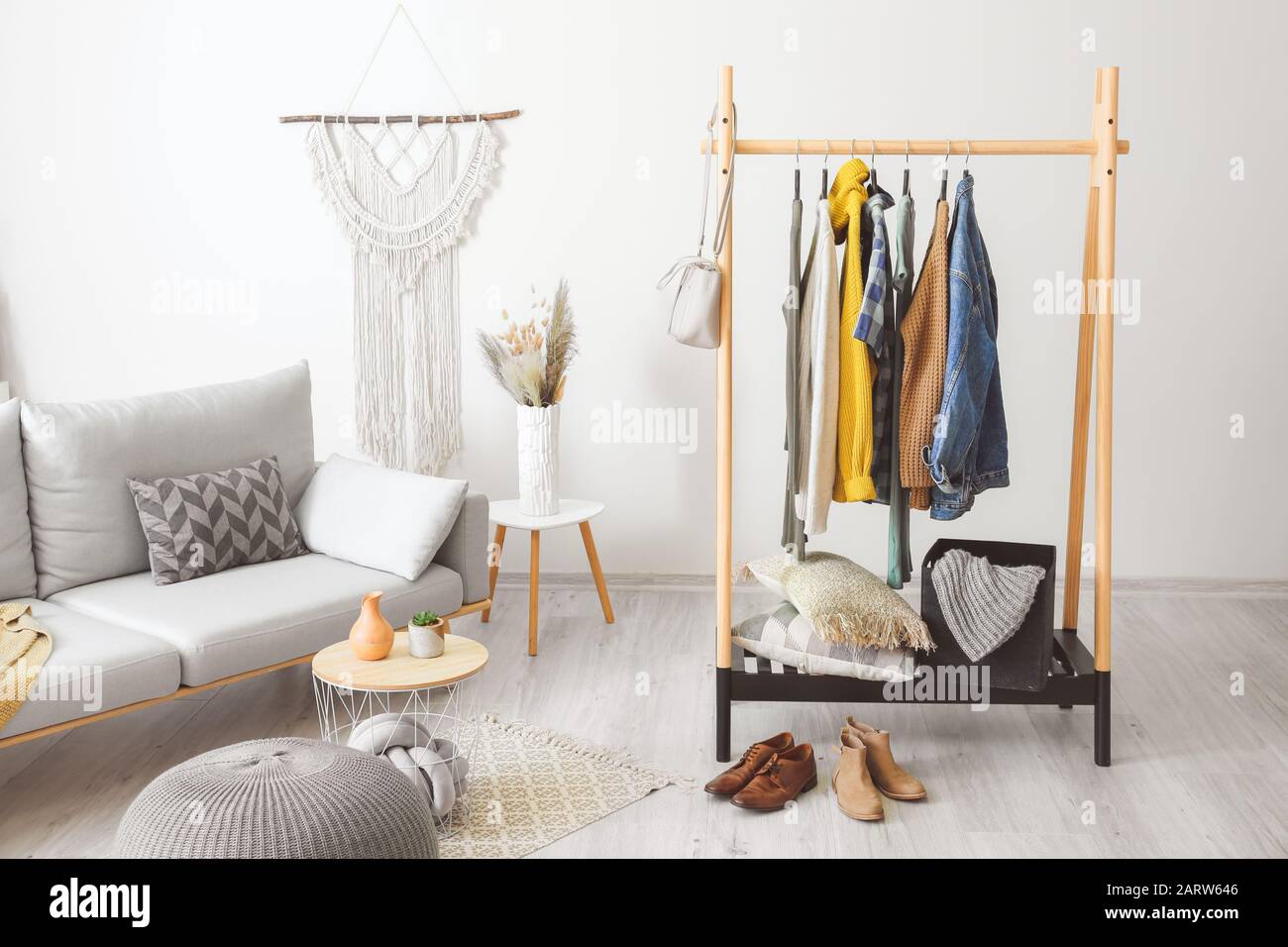 Interior of room with clothes rack Stock Photo - Alamy