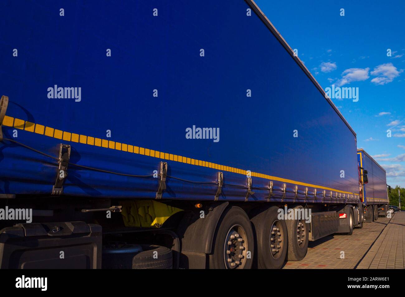 Truck transport. View of the tarpaulin covering the semi-trailer of the truck. Stock Photo