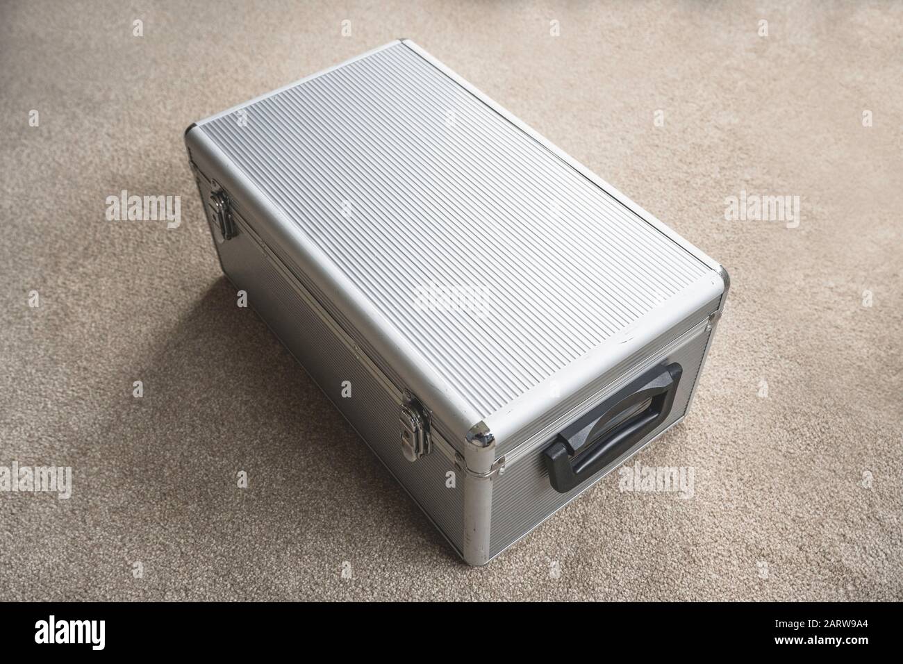 Silver Aluminium CD storage case on the floor display Stock Photo