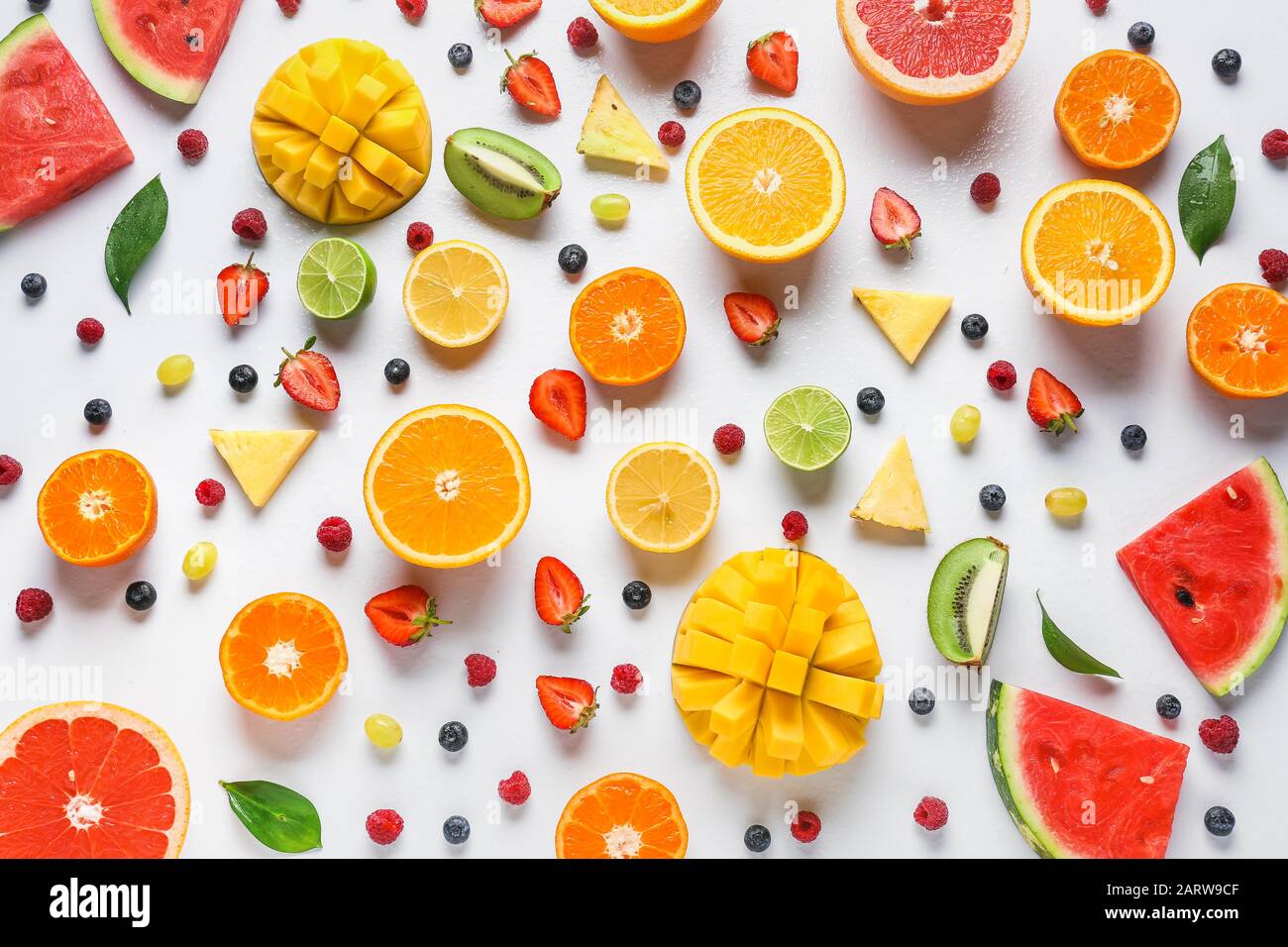 Sweet ripe fruits and berries on white background Stock Photo - Alamy