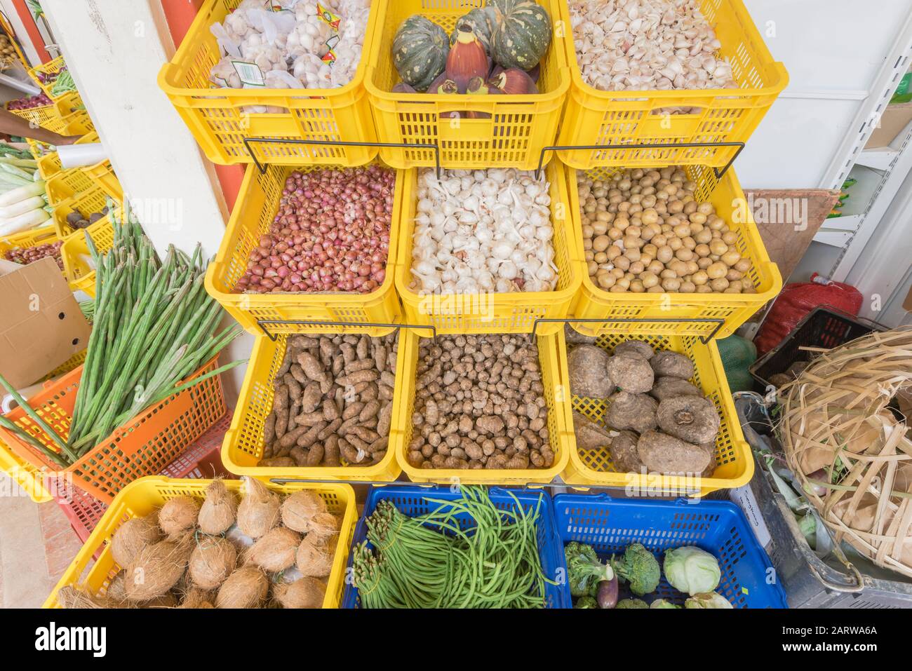 Arrange of plastic crates filled with organic locally grown vegetables