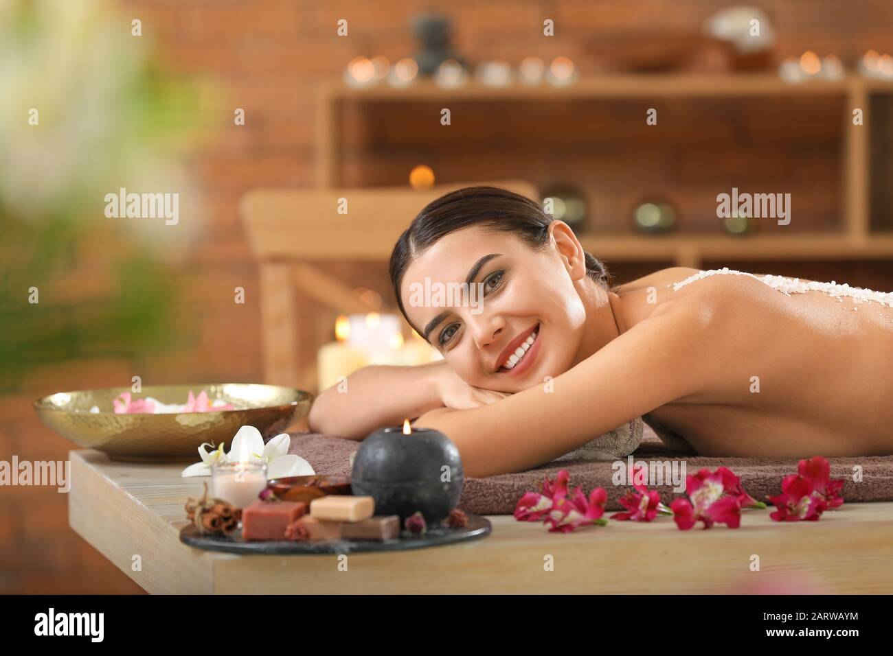 Beautiful young woman relaxing in spa salon Stock Photo - Alamy