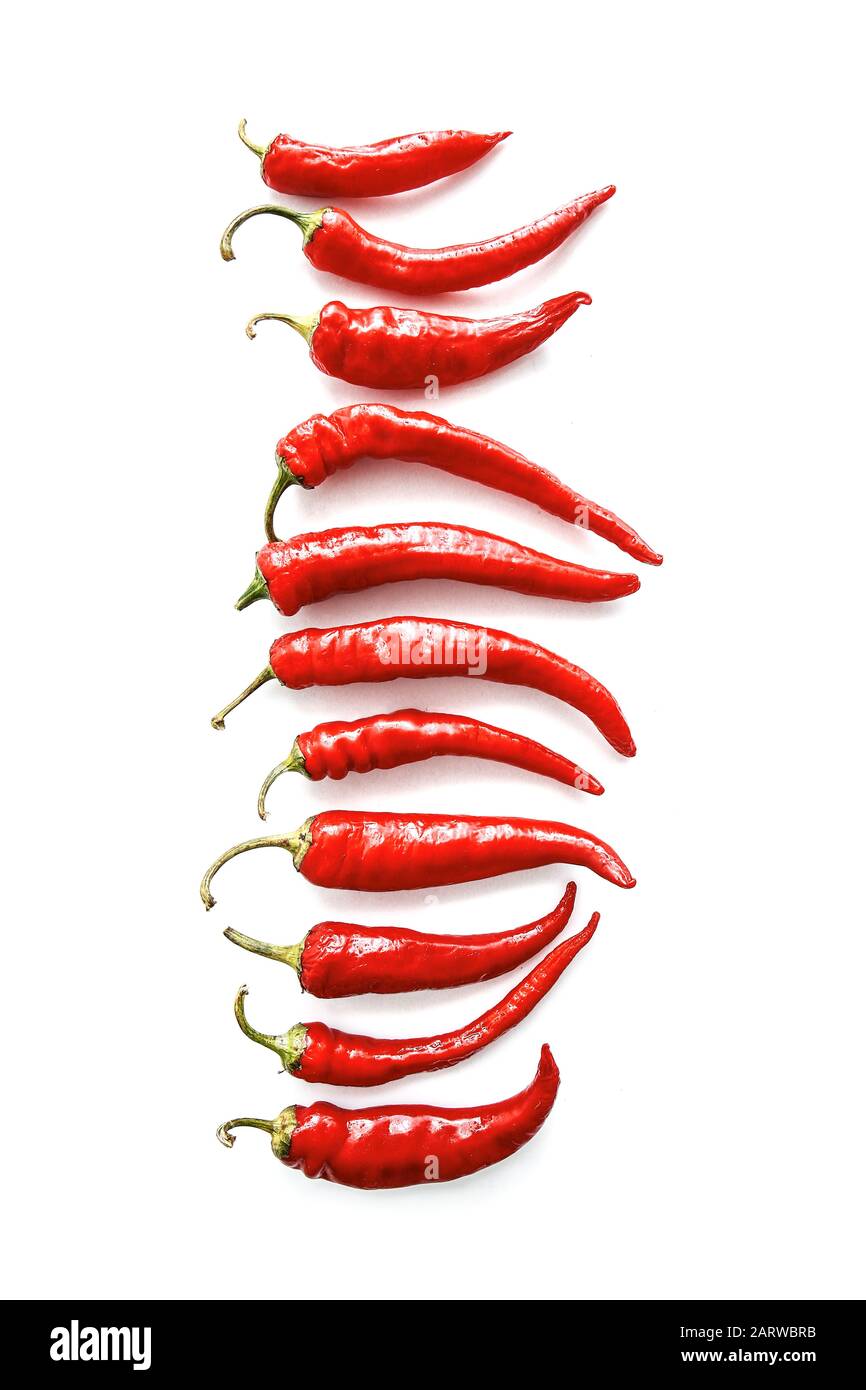 Red chili peppers on white background Stock Photo - Alamy