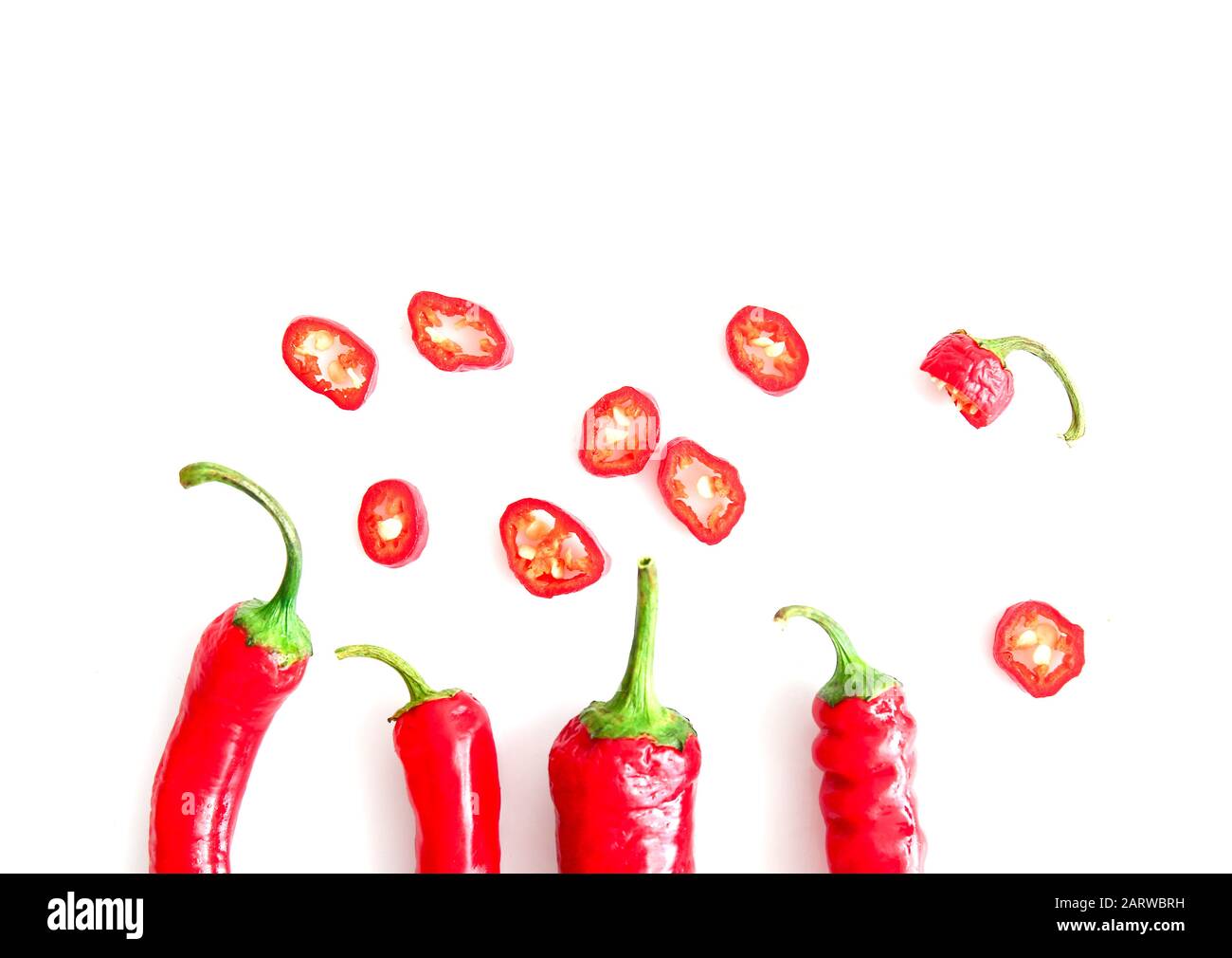 Red chili peppers on white background Stock Photo - Alamy
