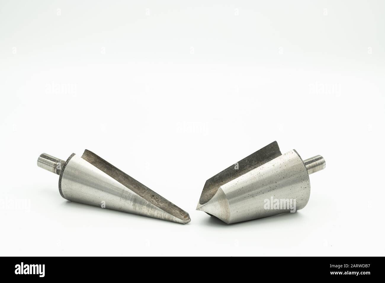 Closeup of two countersink cutters lying on a white background Stock