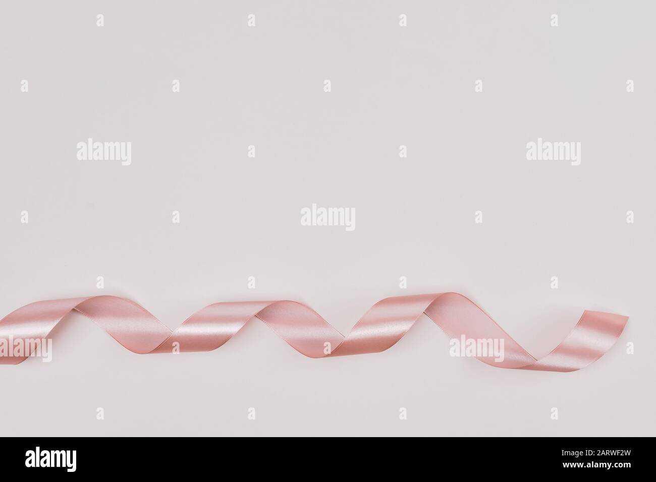 Rustic Pink Ribbon Perfect pink ribbon rolled on pale pink rustic background Stock Photo ...