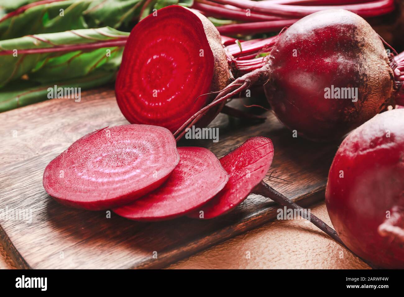 Fresh sliced beet on wooden board Stock Photo