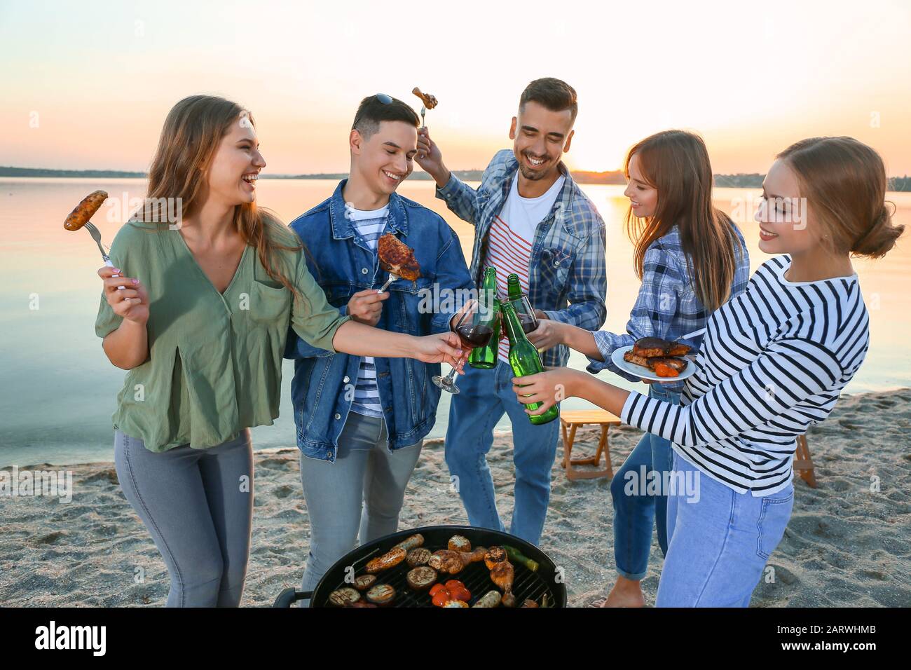 Man beach eating meat hi-res stock photography and images - Alamy