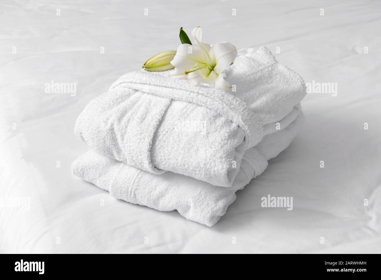Soft clean bathrobes on bed Stock Photo Alamy