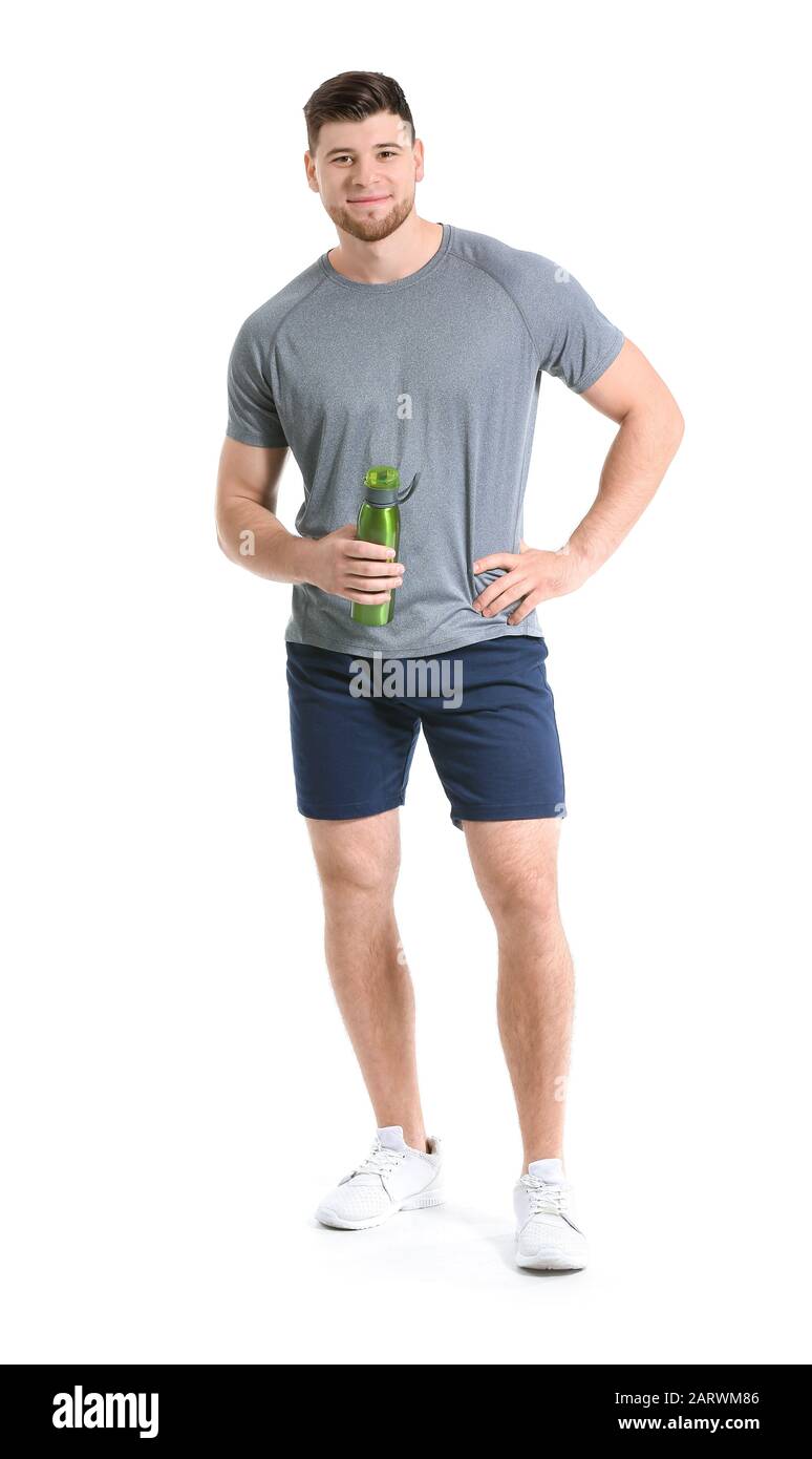 Sporty young man with bottle of water on white background Stock Photo ...