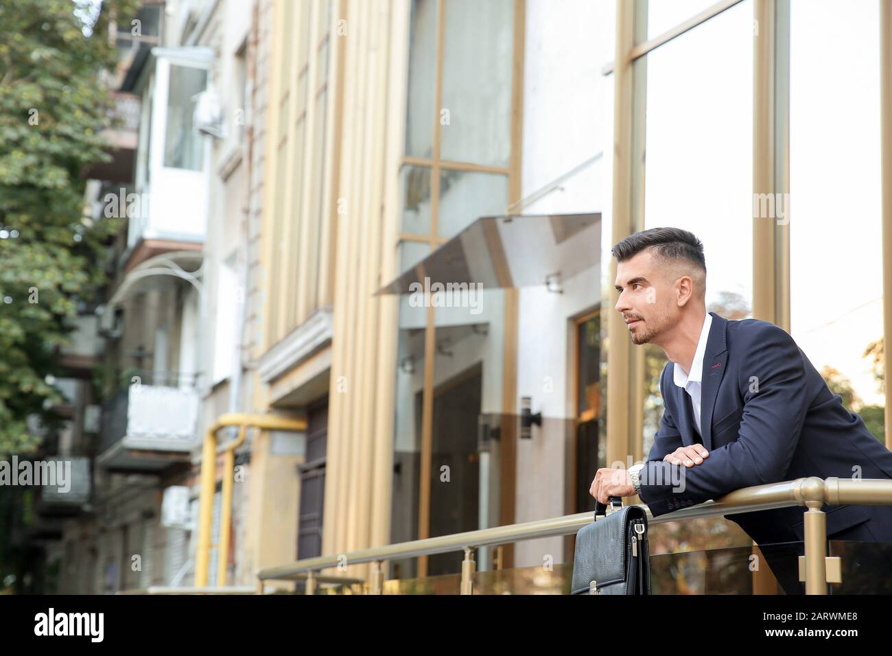 Portrait of handsome businessman outdoors Stock Photo - Alamy
