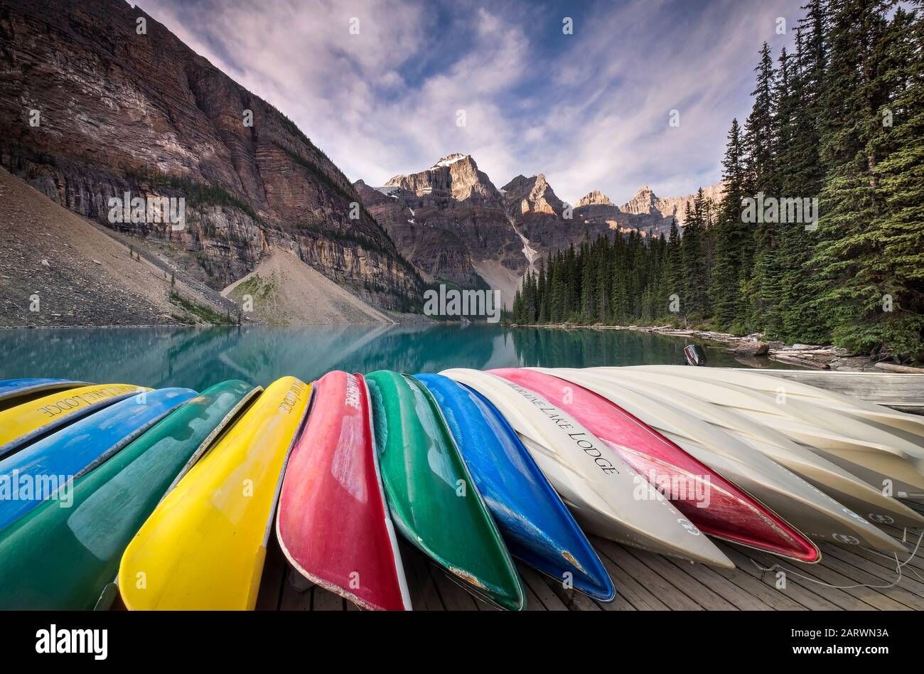 Canoes at Moraine Lake backed by the Wenkchemna Peaks, Valley of the Ten Peaks, Banff National Park, The Rockies, Alberta, Canada Stock Photo