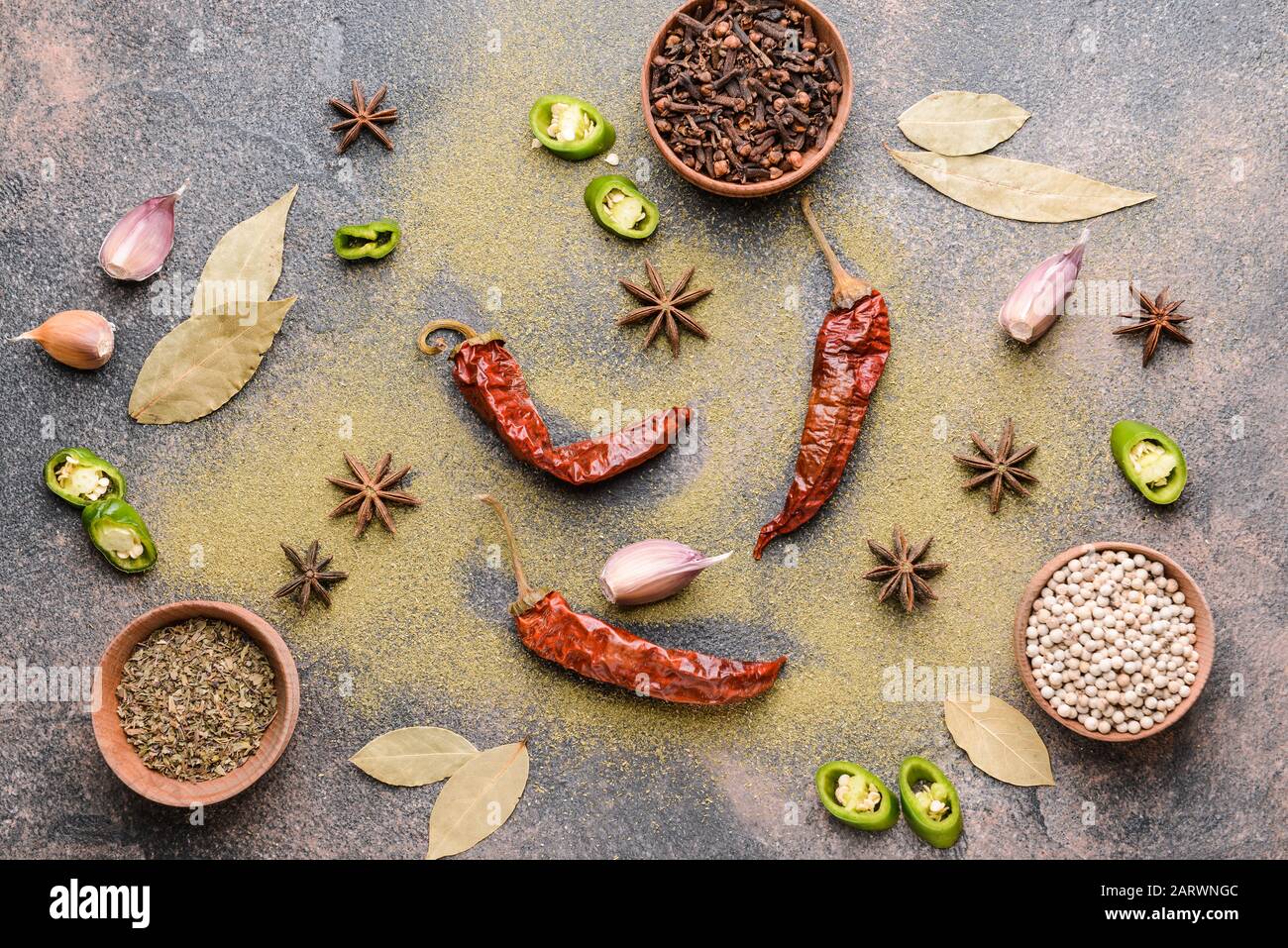 Different spices on grey background Stock Photo
