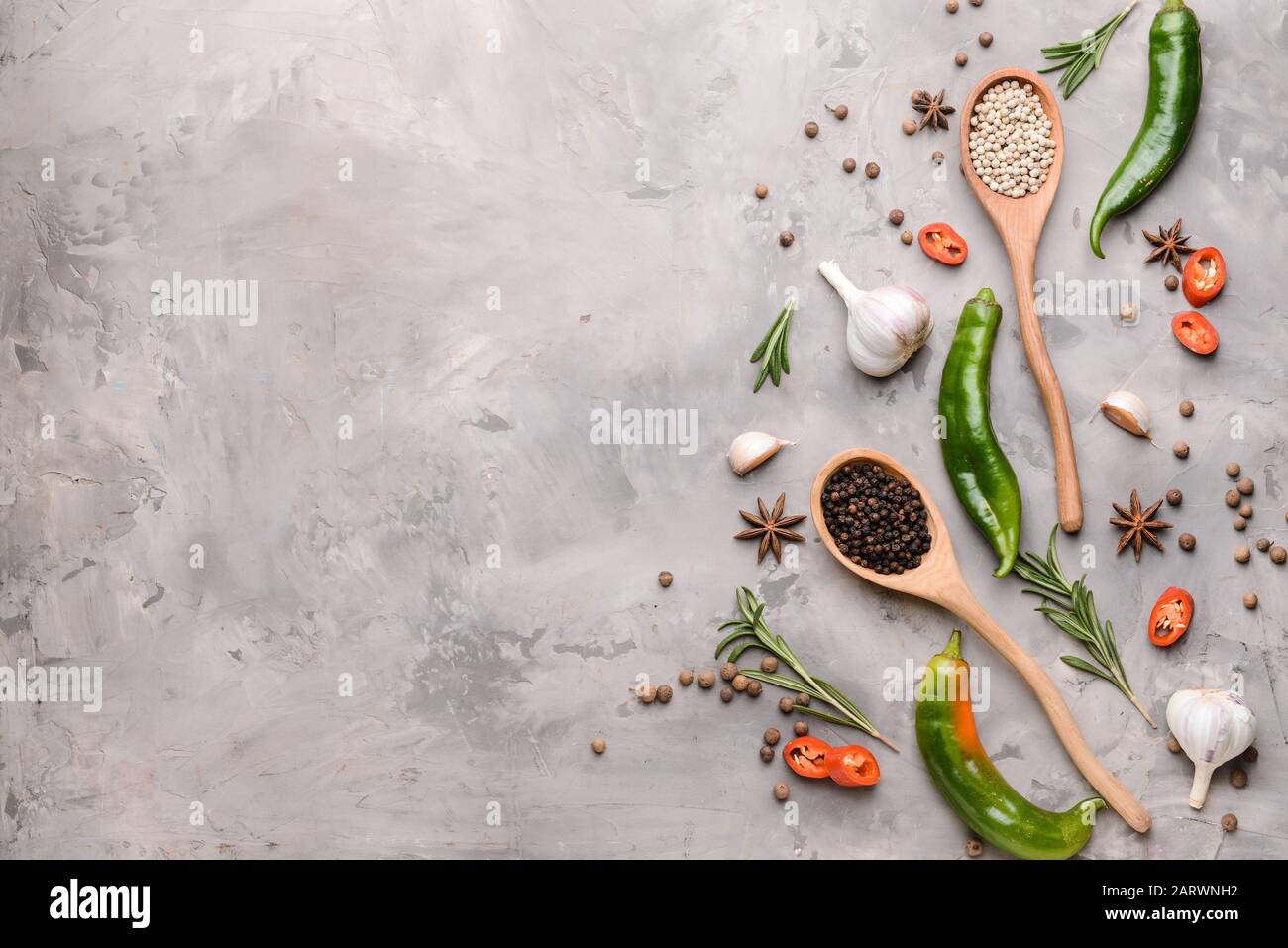 Different spices on grey background Stock Photo