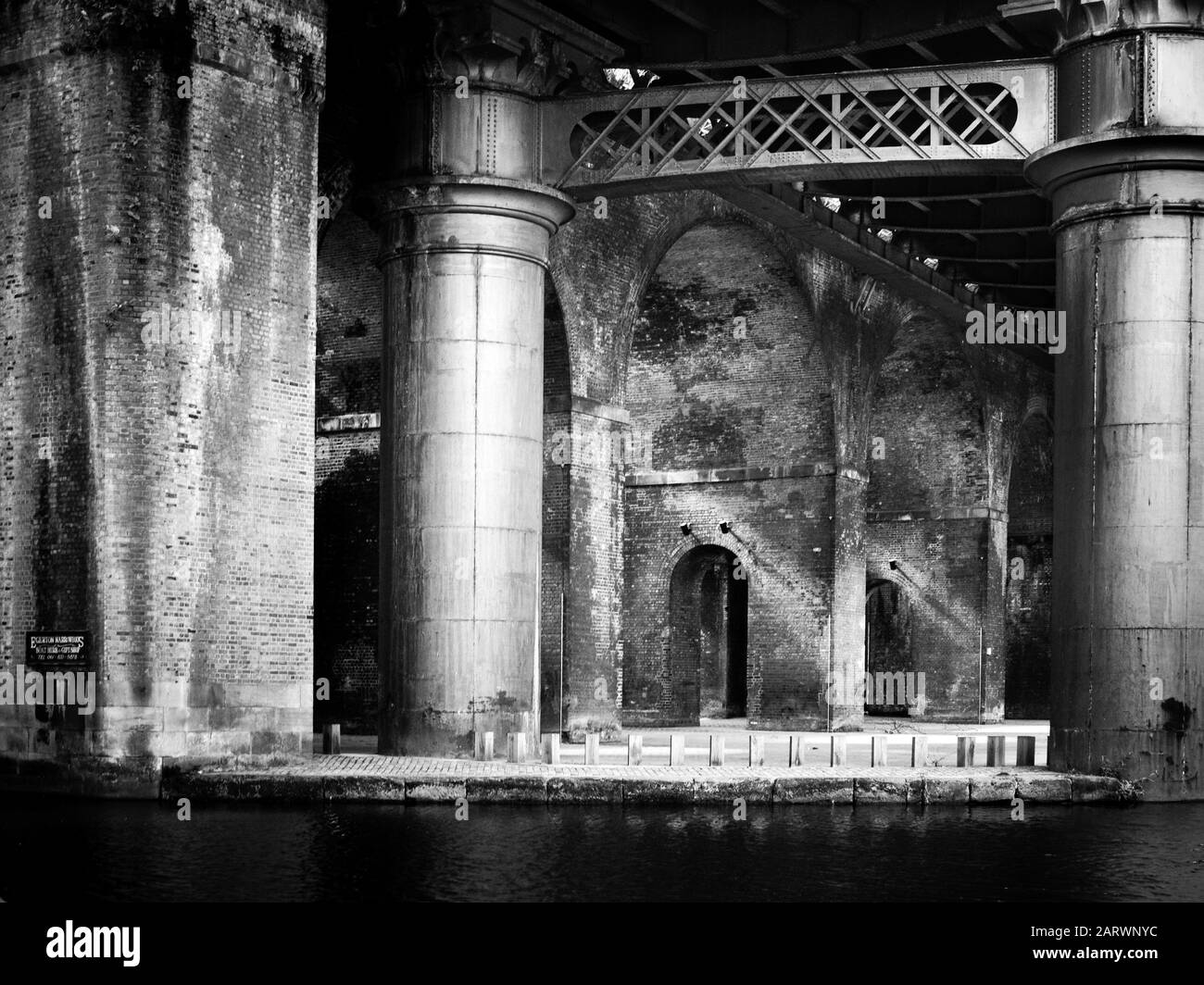 The Bridgwater Canal under the railway viaducts in Manchester Stock Photo