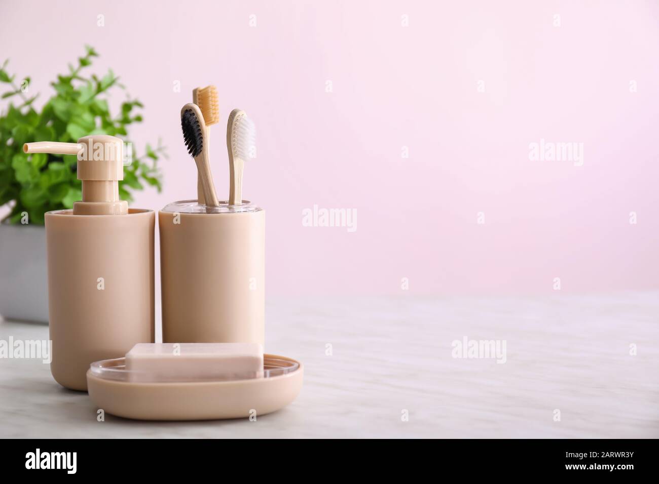 Toothbrushes with soap on table in bathroom Stock Photo Alamy