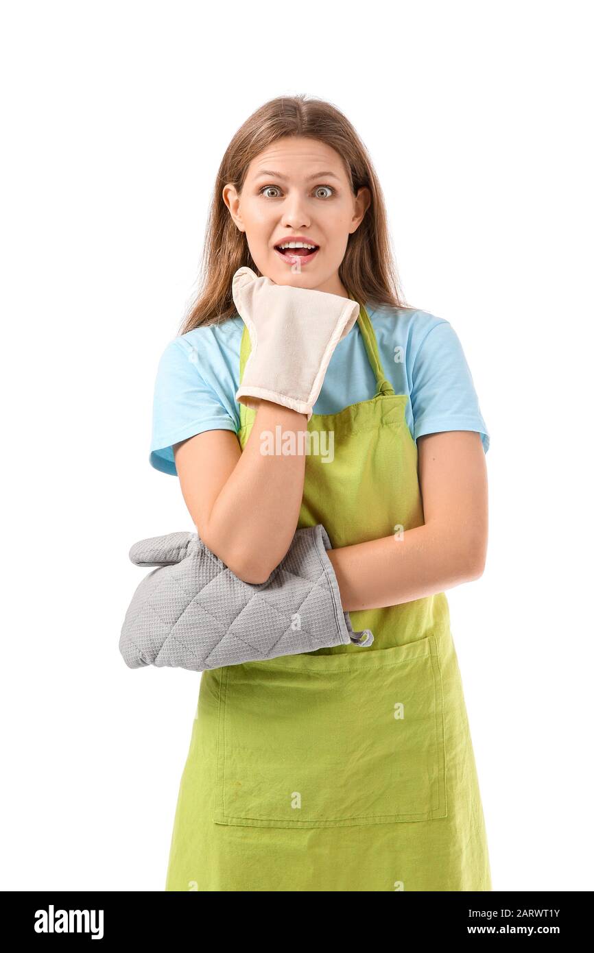 Surprised young woman in apron on white background Stock Photo - Alamy
