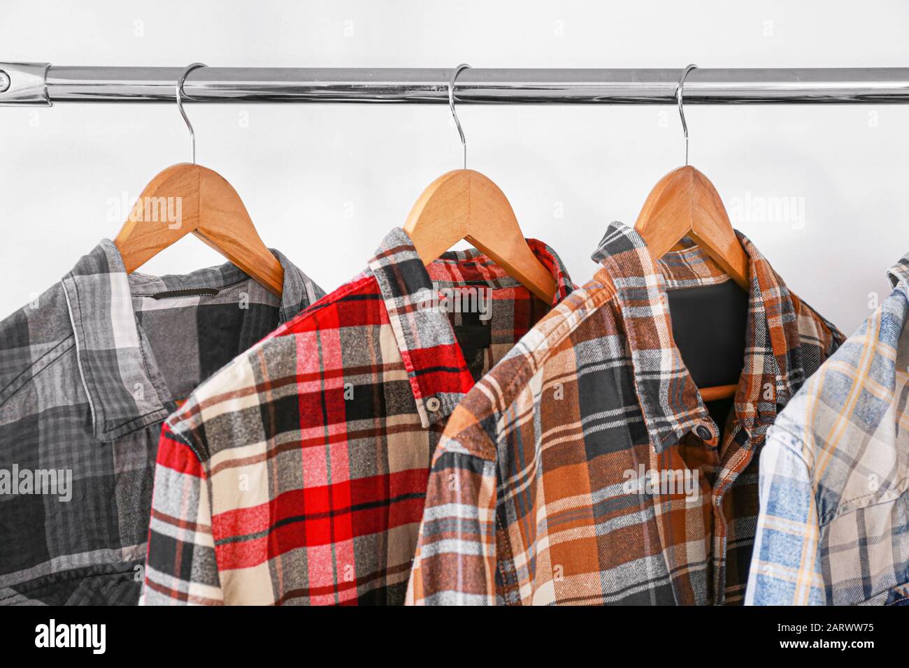 Clothes hanging on rack in wardrobe Stock Photo Alamy