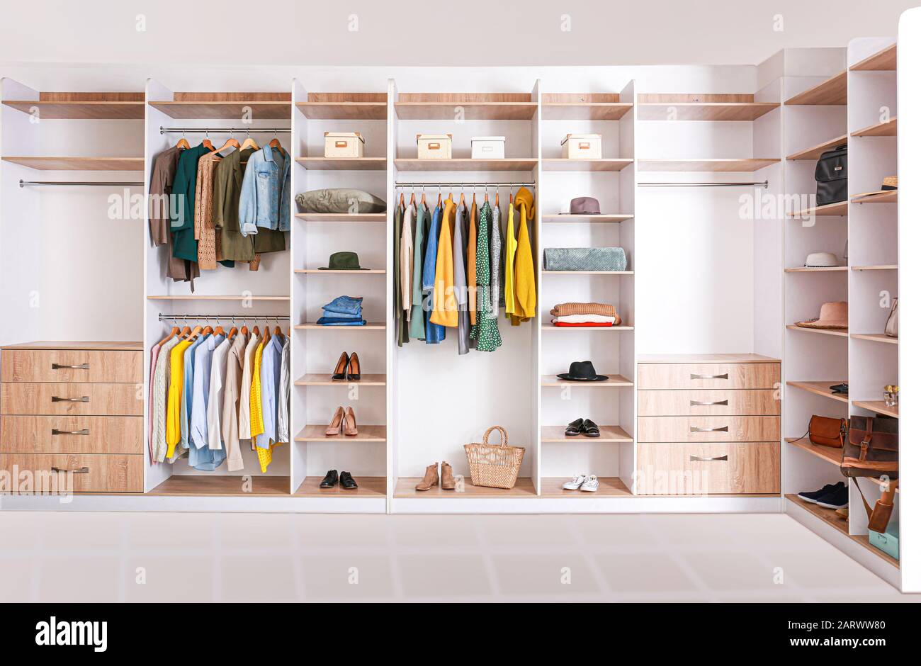 Big wardrobe with clothes in dressing room Stock Photo Alamy