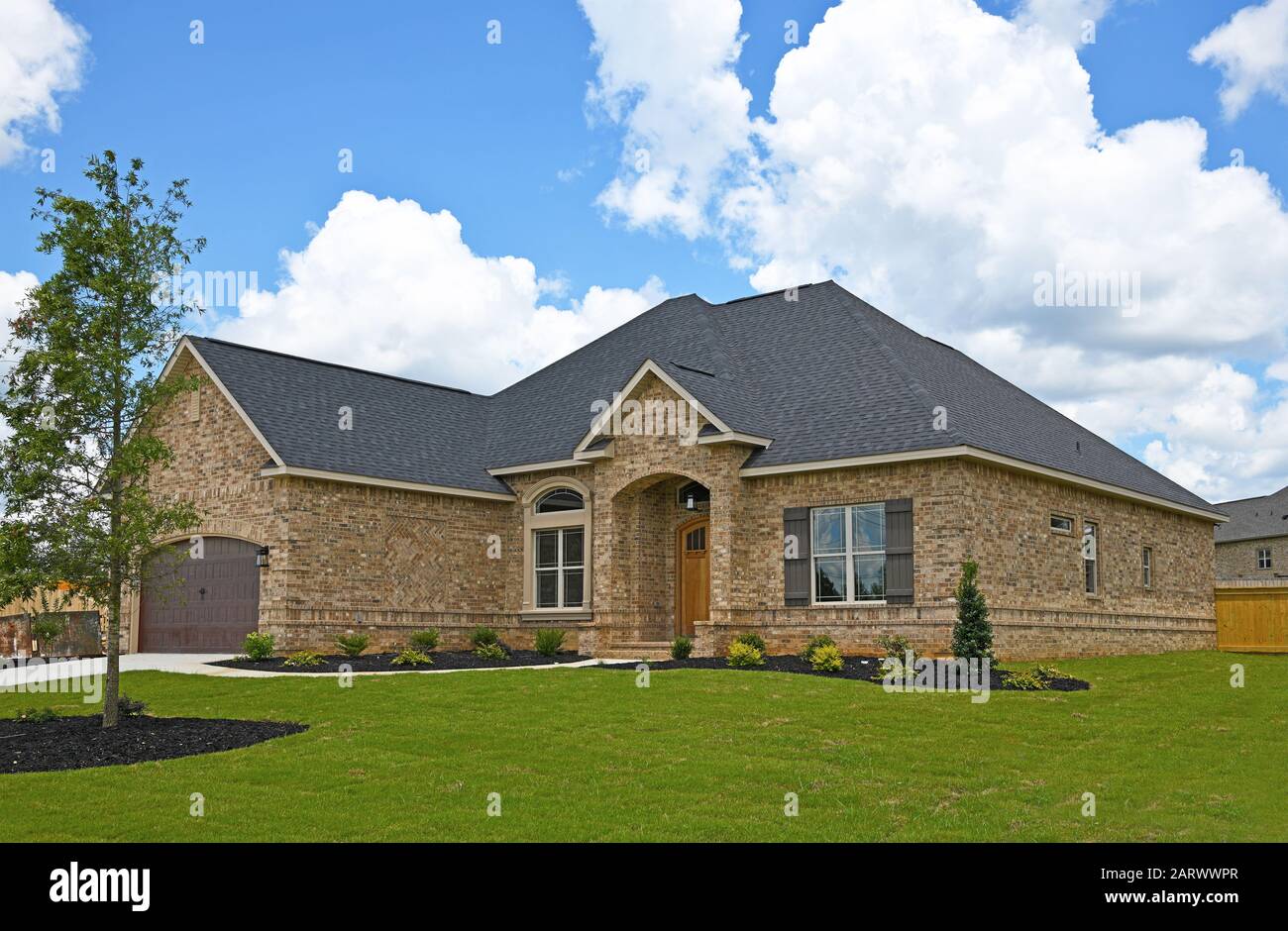 A New Brick House in a Subdivision For Sale Stock Photo