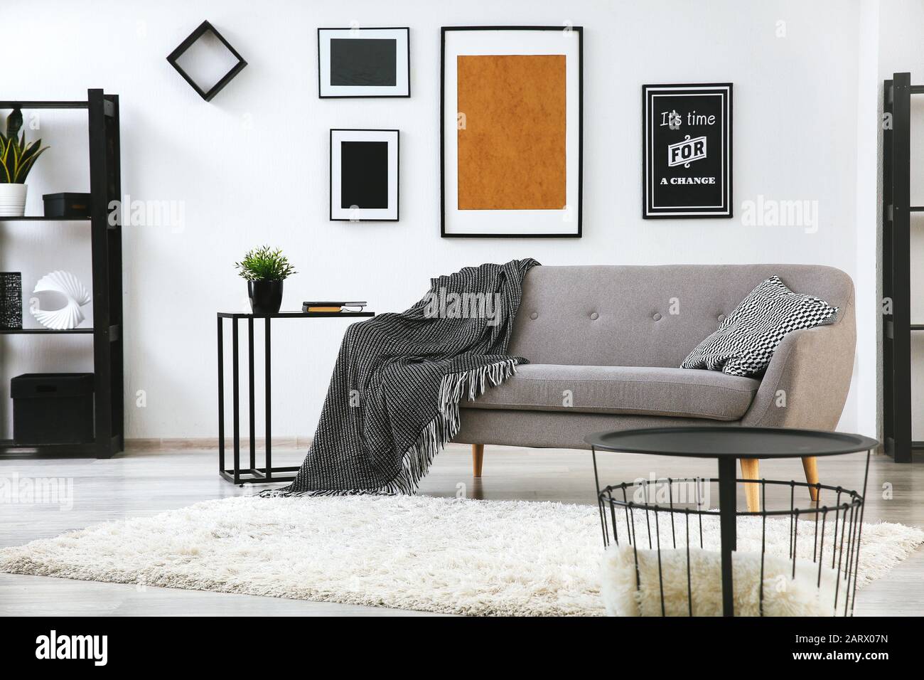 Interior of modern room with comfortable sofa Stock Photo - Alamy