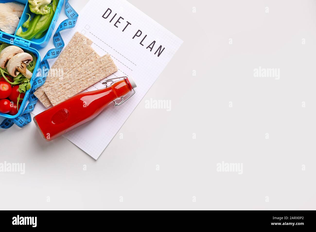 Sheet of paper with diet plan and healthy products on white background ...
