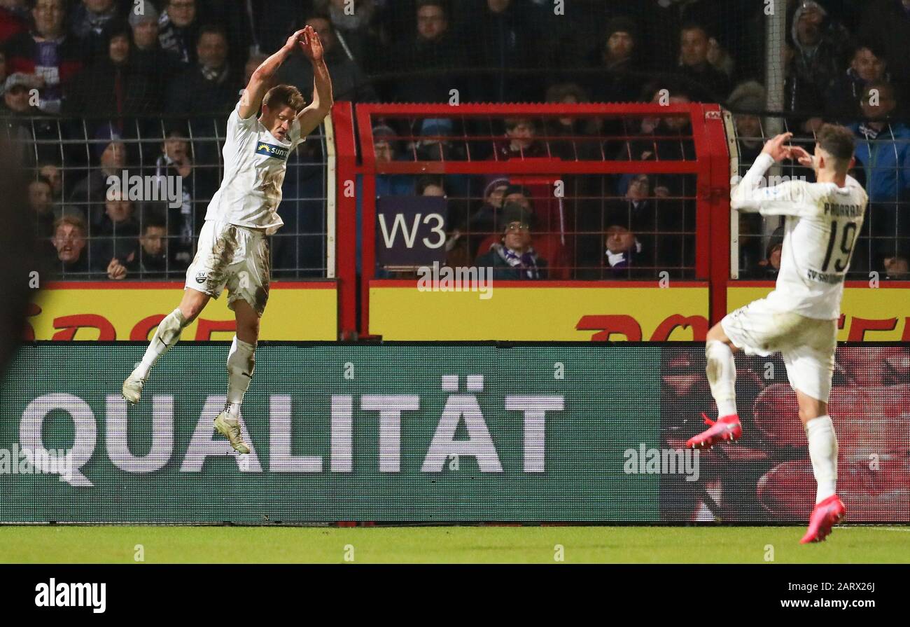 29 January 2020, Lower Saxony, Osnabrück: Football: 2nd Bundesliga, VfL Osnabrück - SV Sandhausen, 19th matchday in the stadium at Bremer Brücke. Goalscorer Kevin Behrens (l) celebrates his goal for the 1:3 with Leart Paqarada from Sandhausen. Photo: Friso Gentsch/dpa - IMPORTANT NOTE: In accordance with the regulations of the DFL Deutsche Fußball Liga and the DFB Deutscher Fußball-Bund, it is prohibited to exploit or have exploited in the stadium and/or from the game taken photographs in the form of sequence images and/or video-like photo series. Stock Photo