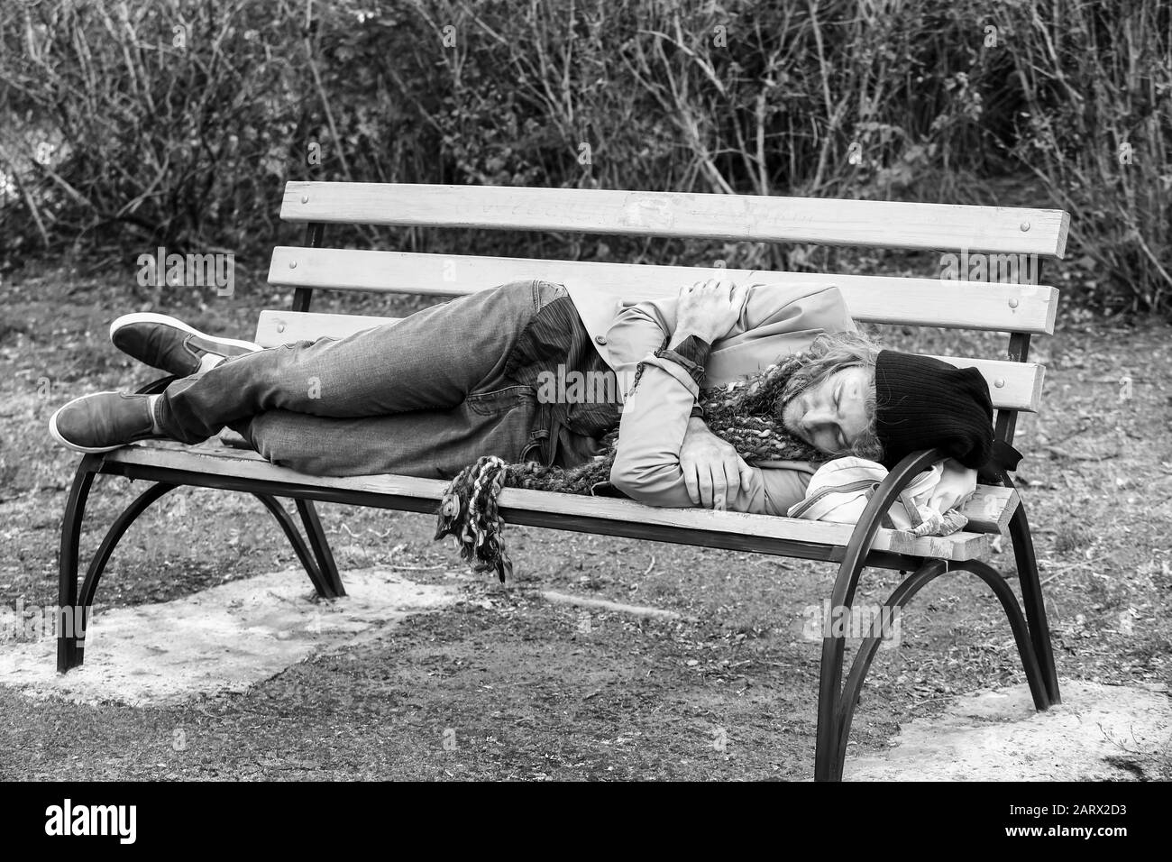Black And White Portrait Of Poor Homeless Man Sleeping On Bench Outdoors Stock Photo Alamy