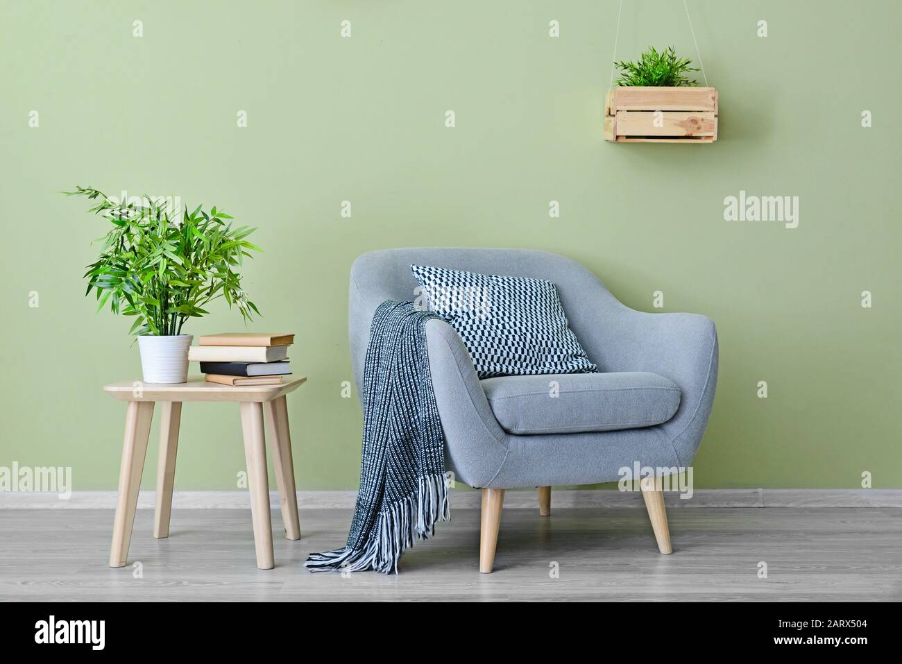 Interior of modern room with armchair and table Stock Photo - Alamy